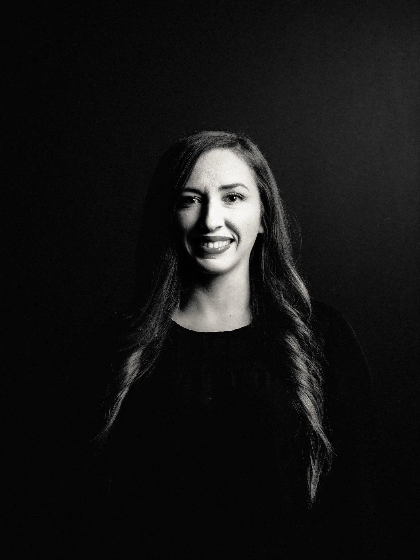 Savanna Barker, founder of Twenty Six Robots, smiling in a black and white portrait